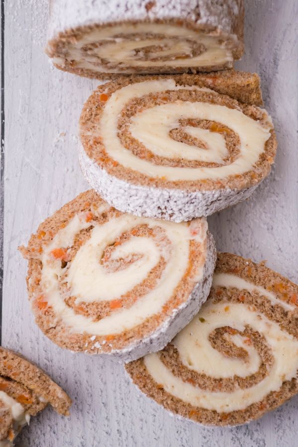 Carrot Cake Roll with three slices cut from one end