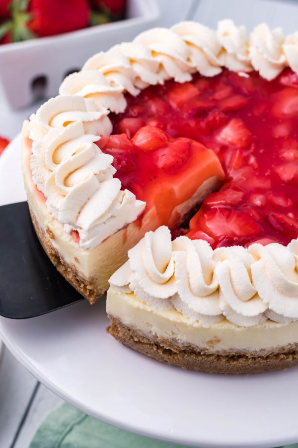 A slice being removed from the Instant Pot Strawberry cheesecake.