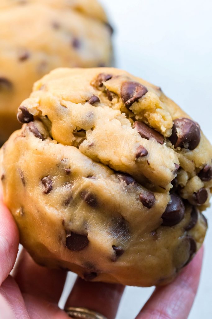 Stuffing a Reese's peanut butter cup into the chocolate chip cookie dough. 