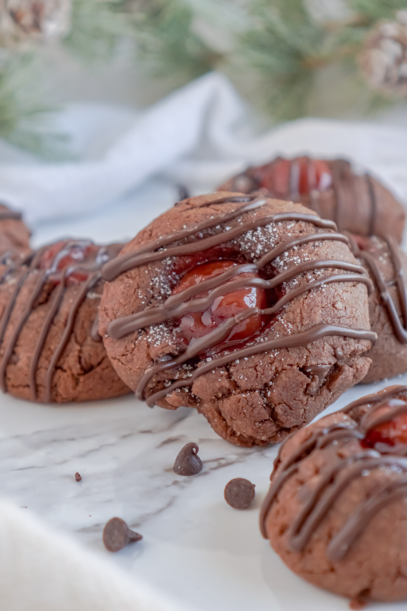 Front view of a Chocolate Cherry Thumbprint Cookie.