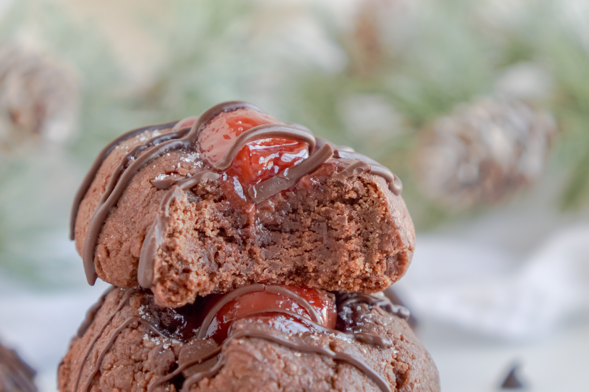 Front view of Chocolate Cherry Thumbprint Cookies stacked.