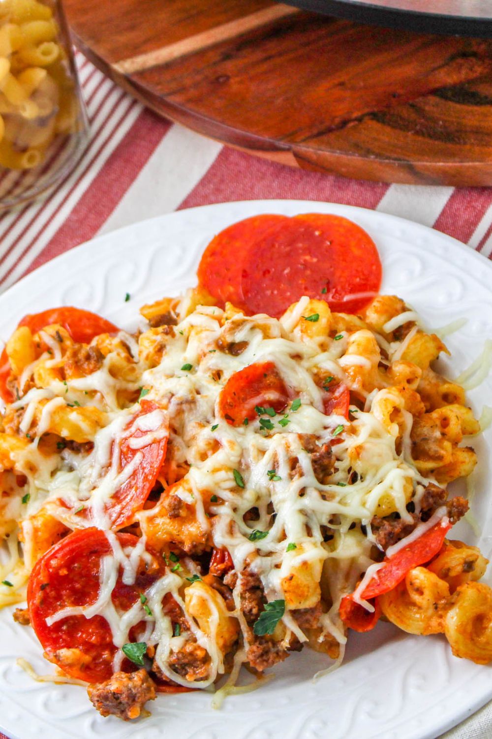 plate with pepperoni and ground beef cheese pasta 