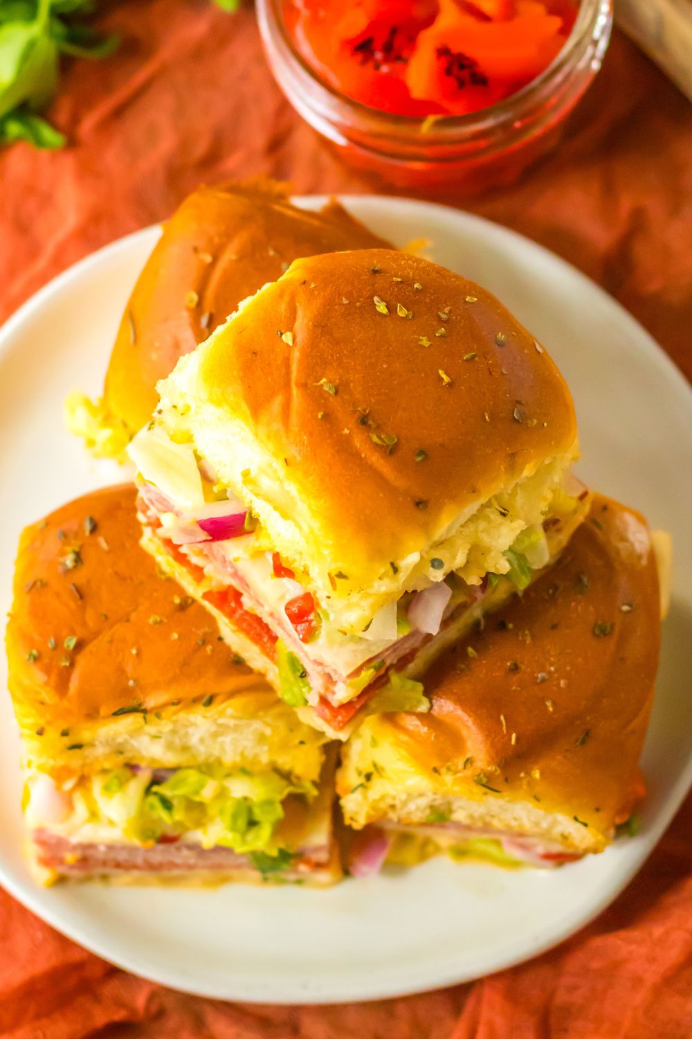 plate with Italian sub sliders on table 